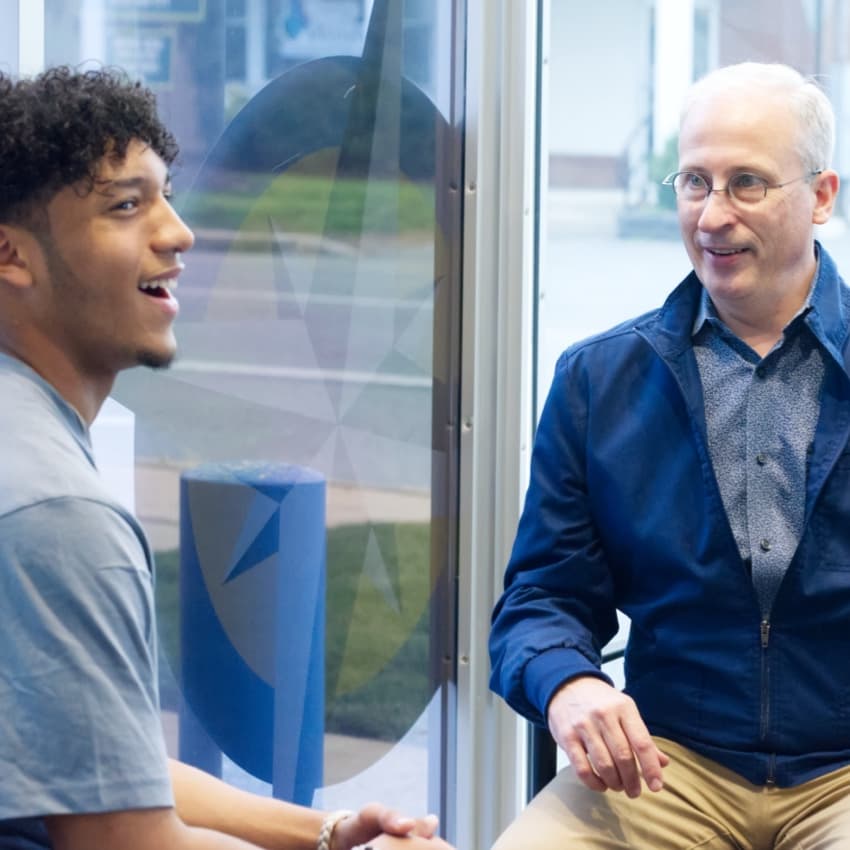 teen patient discussing braces with Dr. Howard