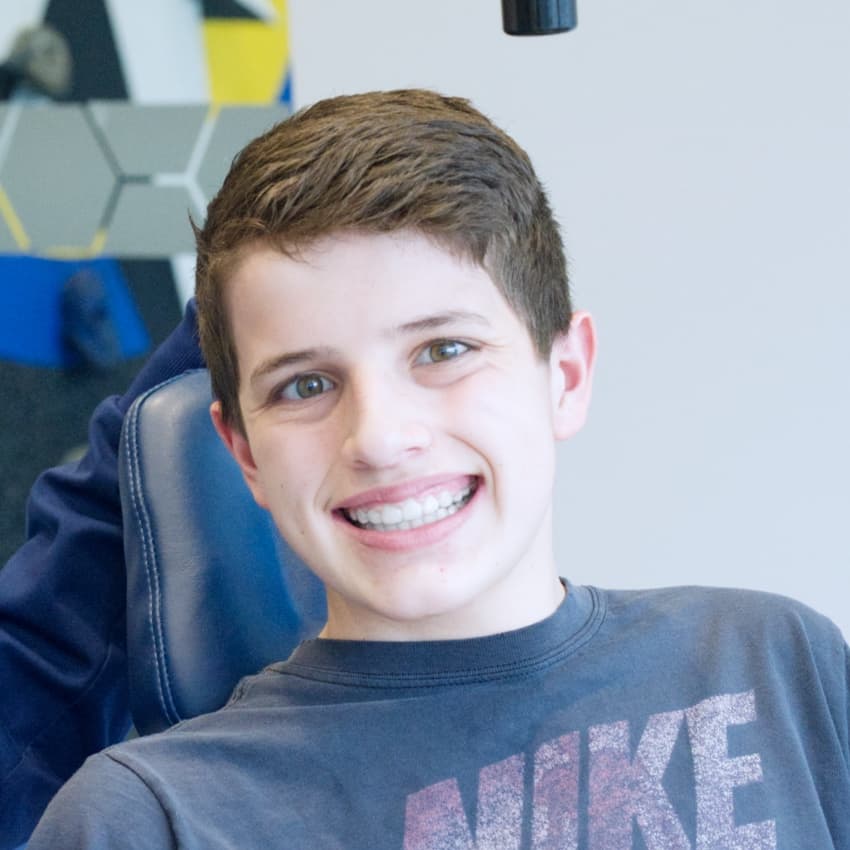 young patient smiling with straight teeth