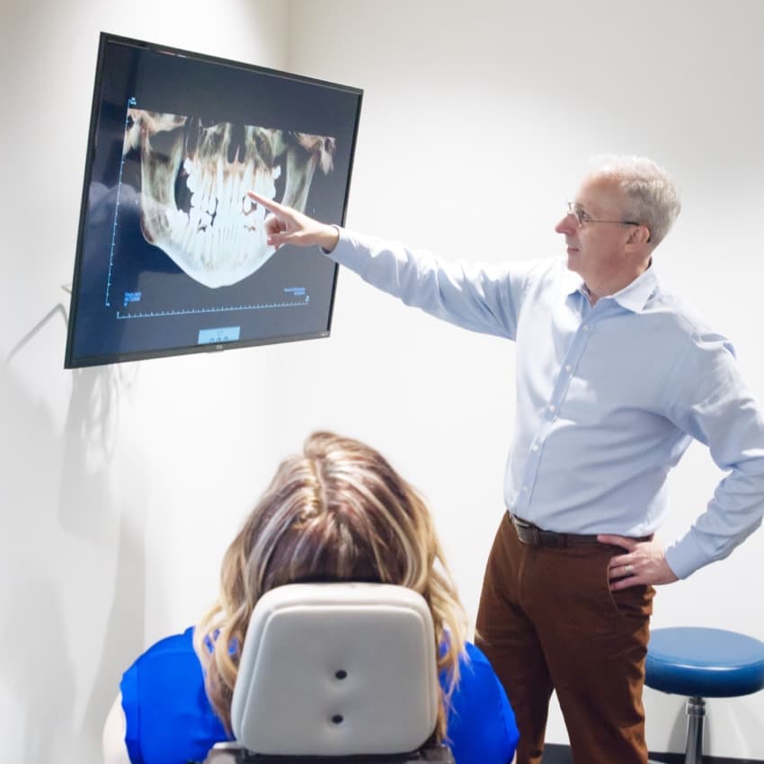 Dr. Howard and patient looking at scans